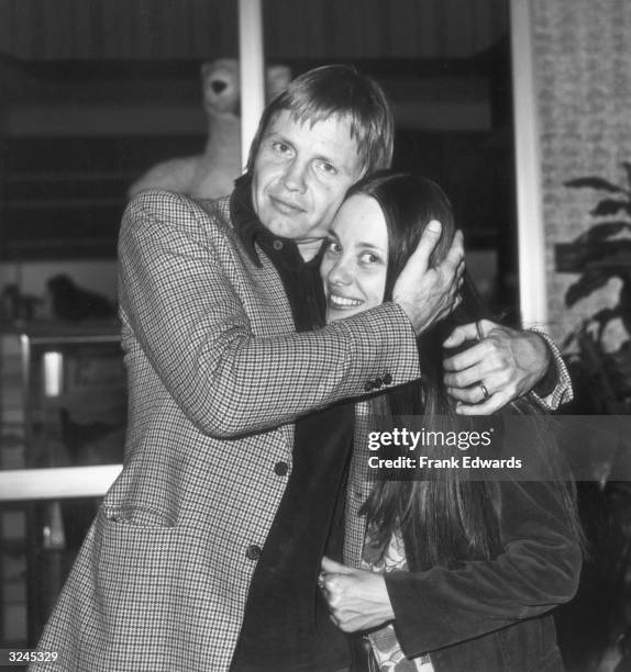 American actor Jon Voight hugs his wife, actor Marcheline Bertrand, at the Filmex Film Festival, Los Angeles, California.
