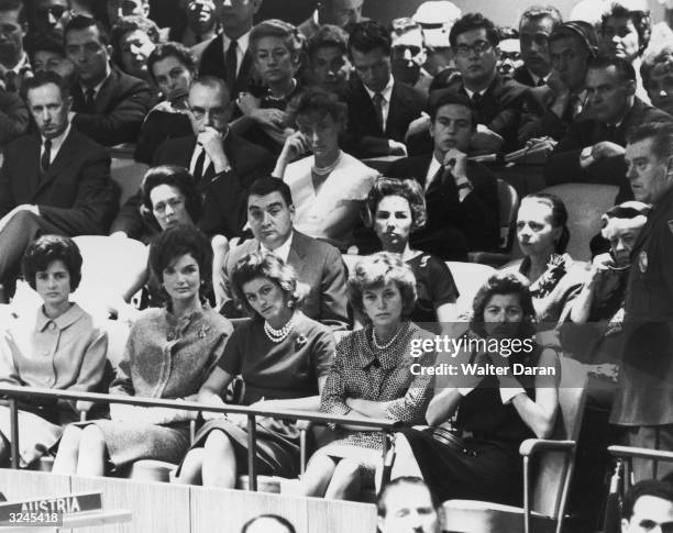 View of an audience assembled to hear John F Kennedy speak at the United Nations, New York City. Pictured are: Jean Kennedy, Jacqueline Kennedy,...