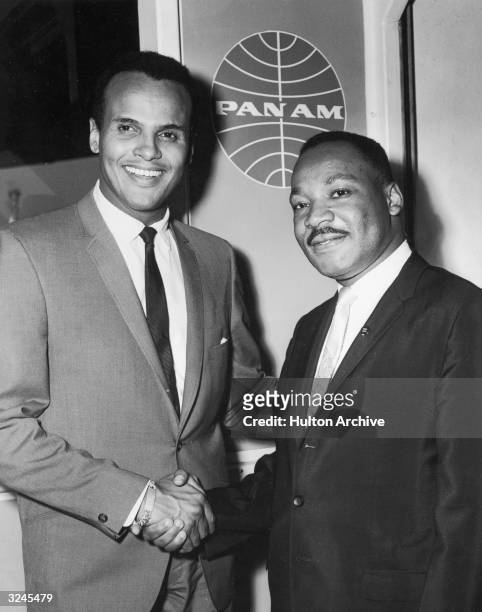 American singer and actor Harry Belafonte Jr. Shakes hands with American civil rights leader Rev. Martin Luther King Jr. At Kennedy International...