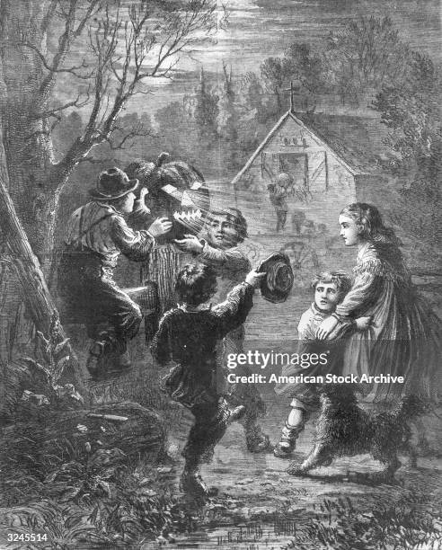 Magazine illustration of a group of children putting an illuminated Jack-o- Lantern on a farm fence post on Halloween night. Engraving titled 'The...