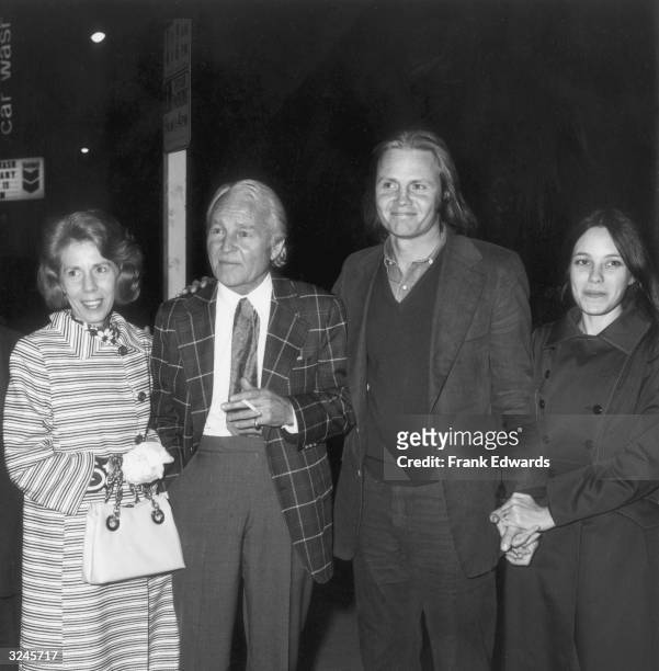 American actor Jon Voight stands outdoors with his wife, actor Marcheline Bertrand, and his parents, at a screening of director Martin Ritt's film...