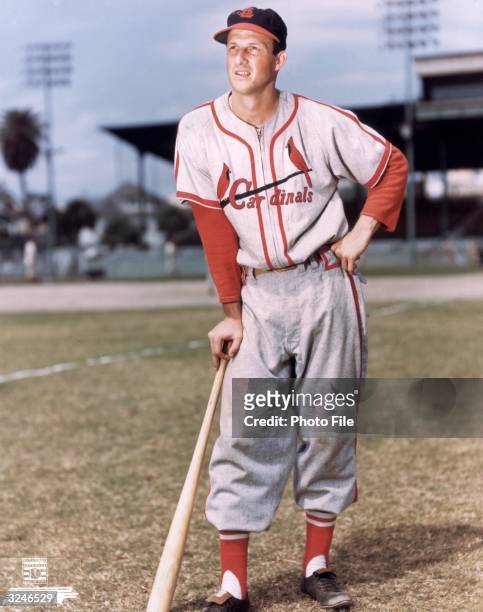 Full-length portrait of American baseball player Stan Musial, first baseman, outfielder and slugger for the St. Louis Cardinals, wearing his uniform...