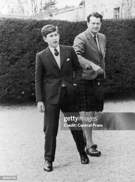 Prince Charles arrives at Gordonstoun School in Scotland for his first term, and is shown around by Captain Iain Tennant, chairman of the board of...