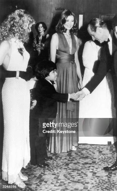 French actor Herve Villechaize welcomes Prince Philip to the premiere of the James Bond film 'The Man with the Golden Gun' at the Odeon, Leicester...