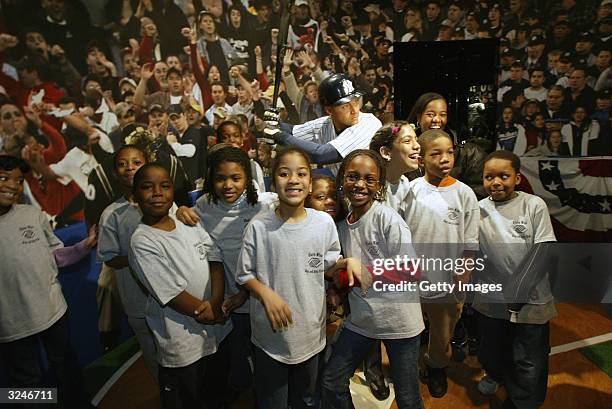 Kids from the Gloria Wise Boys And Girls Club attend the launch of a new interactive experience featuring a figure of baseball player Derek Jeter at...