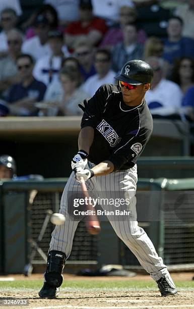 Rene Reyes of the Colorado Rockies bats during the game against the Kansas City Royals on March 7, 2004 at Surprise Stadium in Surprise, Arizona. The...