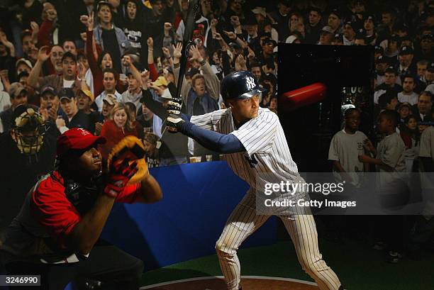 Carlito Rivera, an employee at the museum, catches a ball at the launch of a new interactive experience featuring a figure of baseball player Derek...