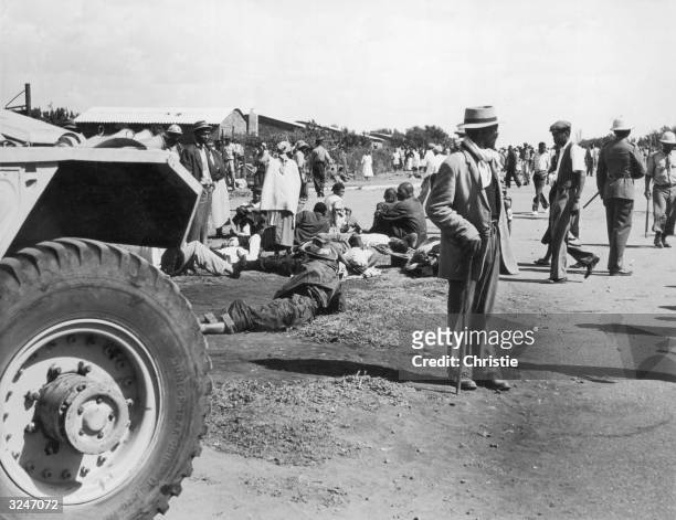 The aftermath of riots in the streets of Sharpeville, 38 miles from Johannesburg. The rioting was in response to laws requiring black citizens to...