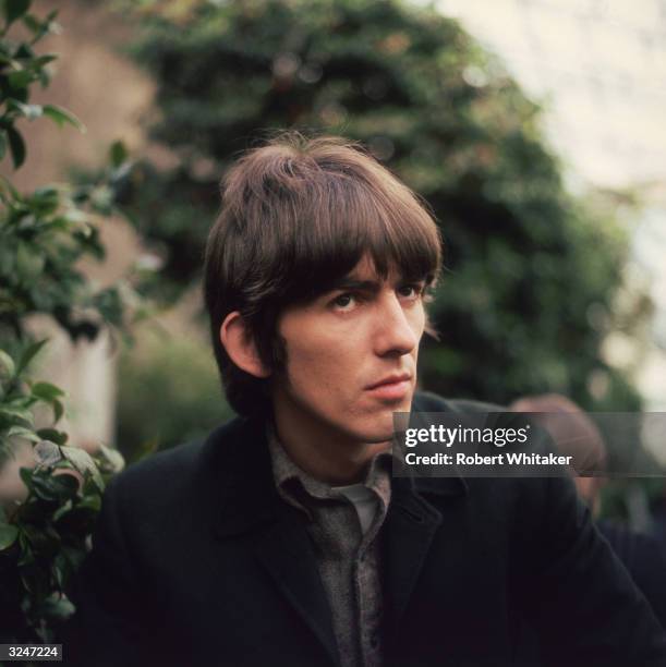 George Harrison of the Beatles, sporting the group's distinctive haircut during filming at Chiswick House.