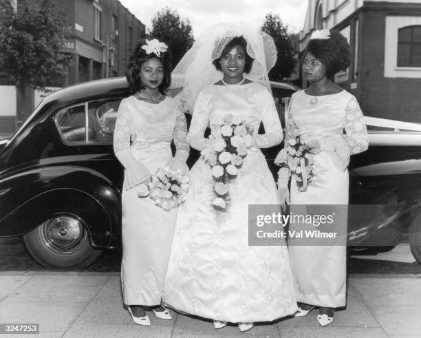 Woman from Sierra Leone arrives at a church in Stamford Hill, London, on her wedding day.