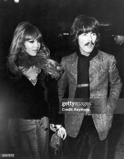 George Harrison and his wife Patti Boyd arriving at the London Pavilion for the premiere of 'How I Won The War' which stars his fellow Beatle John...