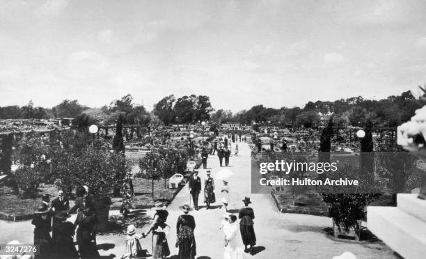 People promenading through El Rosedal in Palermo, Buenos Aires.