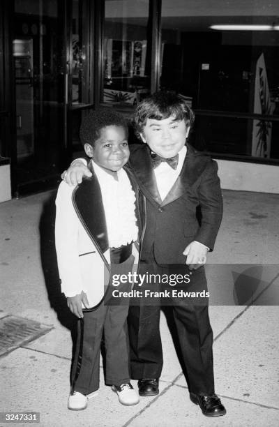American child actor Gary Coleman and French actor Herve Villechaize posing together in tuxedos at the Fifth Annual Emmy Awards Banquet, Exhibition...