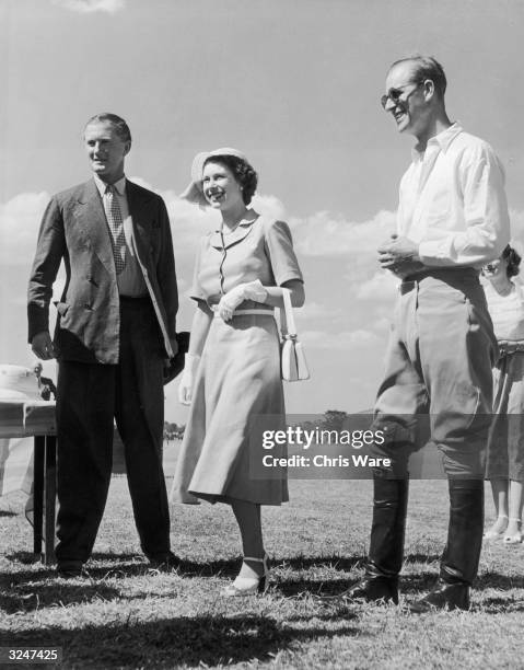 Princess Elizabeth and the Duke of Edinburgh attend a polo match at Nyeri in Kenya, only days before the death of her father, King George VI.