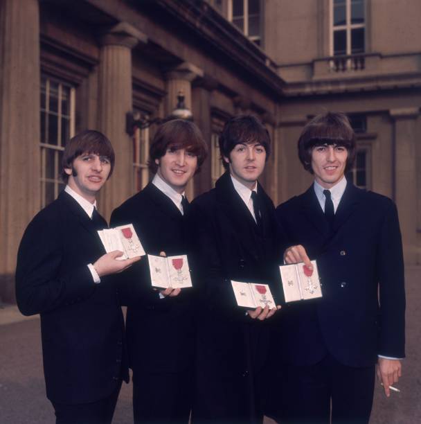 British pop group The Beatles, from left to right; Ringo Starr, John Lennon , Paul McCartney and George Harrison , outside Buckingham Palace, London,...