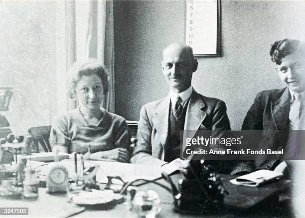 Otto Frank , father of German diarist and Holocaust victim Anne Frank, sits with his secretary Miep Gries, protector of the Frank family during Nazi...