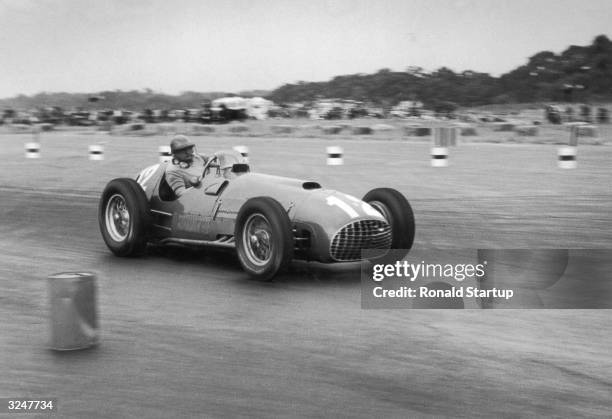 Froilan Gonzalez in his Ferrari 375 on his way to victory in the British Grand Prix at Silverstone. Original Publication: Picture Post - 5370 - BRM...