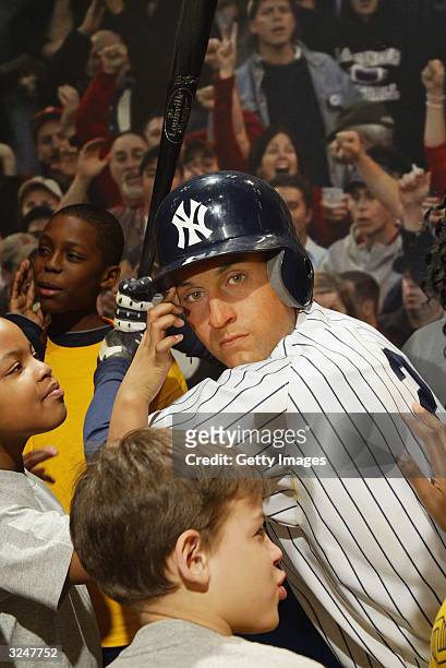 Members of the Gloria Wise Boys And Girls Club attend the launch of a new interactive experience featuring a figure of baseball player Derek Jeter at...