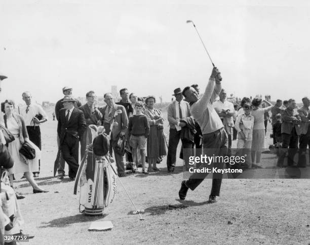 American golfer Arnold Palmer takes a practise swing before the British Open Golf Championships at Royal Birkdale.