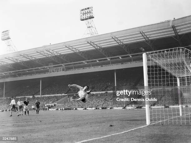 England goalkeeper Gordon Banks clears from a free kick during the soccer international against Scotland at Wembley. England lost by two goals to one.