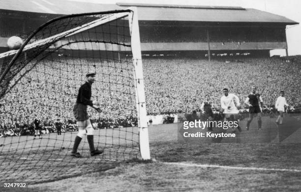 Loy, the Eintracht goal keeper can only watch as Ferenc Puskas of Real Madrid scores his team's sixth goal during the European Cup Final against...