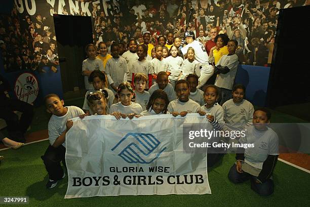 Members of the Gloria Wise Boys And Girls Club attend the launch of a new interactive experience featuring a figure of baseball player Derek Jeter at...