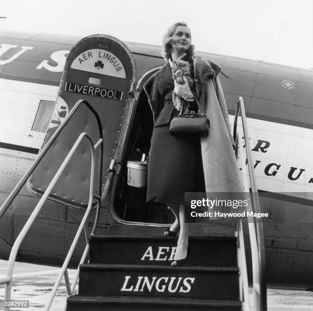 Beauty queen Stephanie Howell, the Sta-Blond Queen of 'Fairheads', returns from Ireland on an Aer Lingus plane after a round of personal appearances...