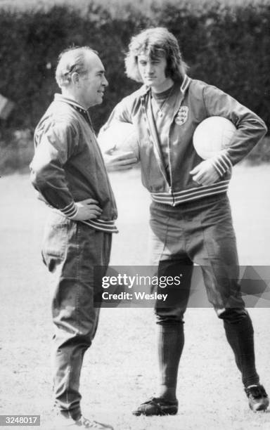 Footballer Rodney Marsh with England manager Sir Alf Ramsey at the Bank of England sports ground in Roehampton during a training session for the...