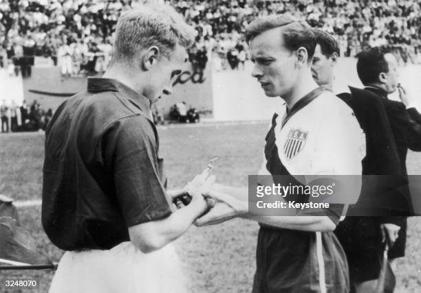The captains of England and USA, Billy Wright and Ed McIlvenny exchange souvenirs at the start of their match on June 29, 1950 in Belo Horizonte,...