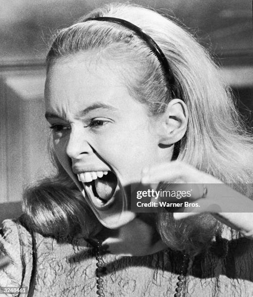 American actor Sandy Dennis screaming in a still from the film, 'Who's Afraid of Virginia Woolf?,' directed by Mike Nichols, based upon the play by...