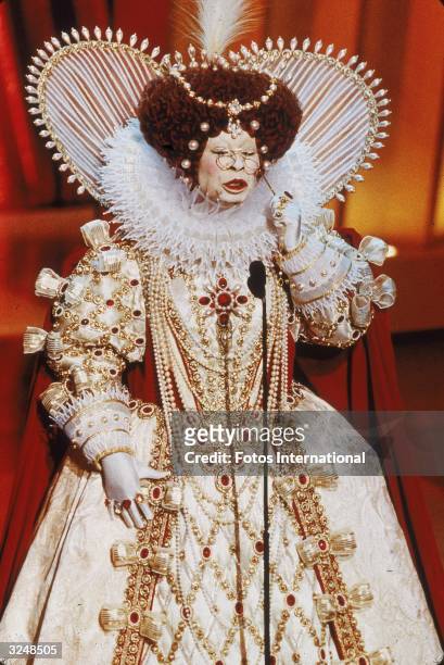 American actor and comedian Whoopi Goldberg delivers her opening monologue dressed as Queen Elizabeth I, while hosting the 71st Annual Academy...