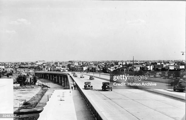 Cars travel on the Triborough Bridge ramp to Astoria, Queens, New York City.