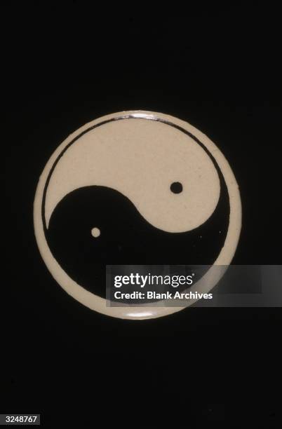 Button featuring the Chinese cosmological symbol, Yin-yang.