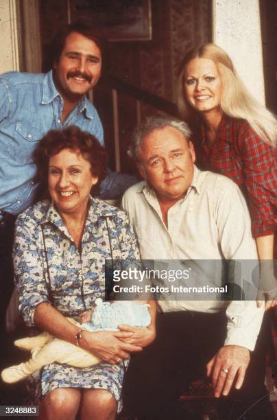 Portrait of the cast of the television show 'All in the Family'. Clockwise from lower right: Carroll O'Connor , Jean Stapleton holding Corey M...