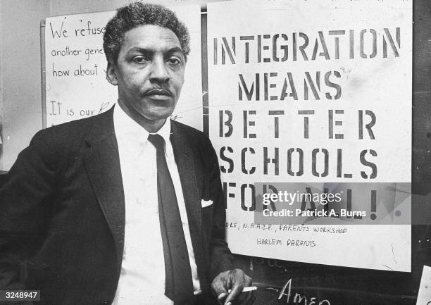 American civil rights activist Bayard Rustin , spokesman for the Citywide Committee for Integration, at the organization's headquarters at Silcam...