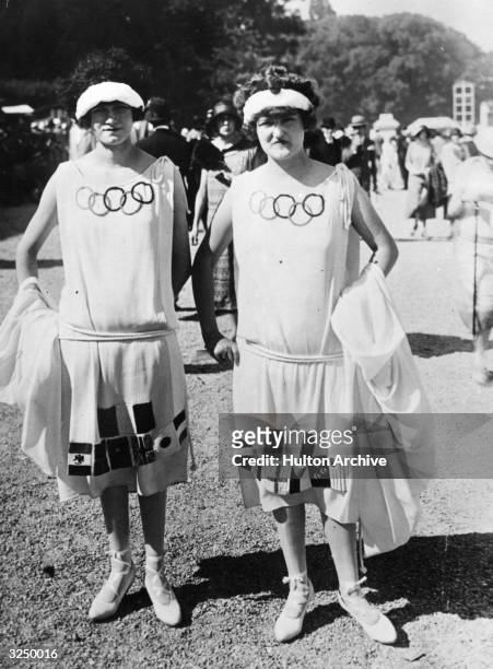 Couple of ladies wearing Olympic Gown at Longchamp.