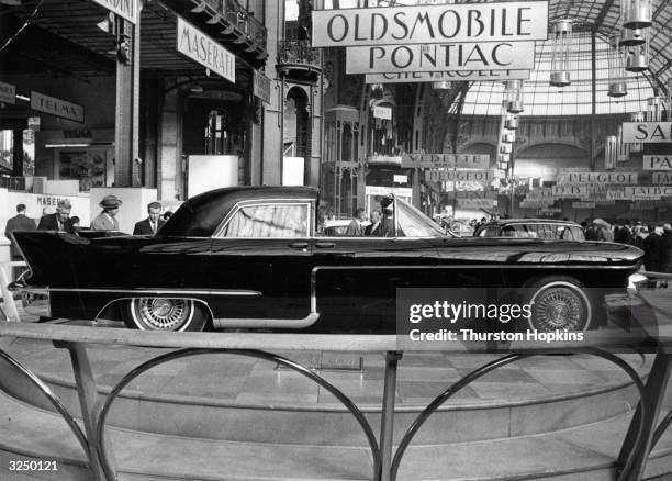 The new Cadillac luxury car at the Paris Motor Show. Original Publication: Picture Post - 8714 - Cars For 1957 - pub. 1956