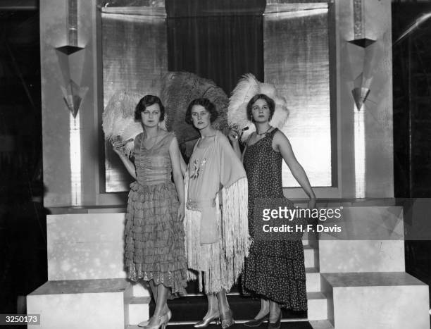 Three smart evening dresses from the Mannequin Parade, at the British Artificial Silk Exhibition at Olympia, London.