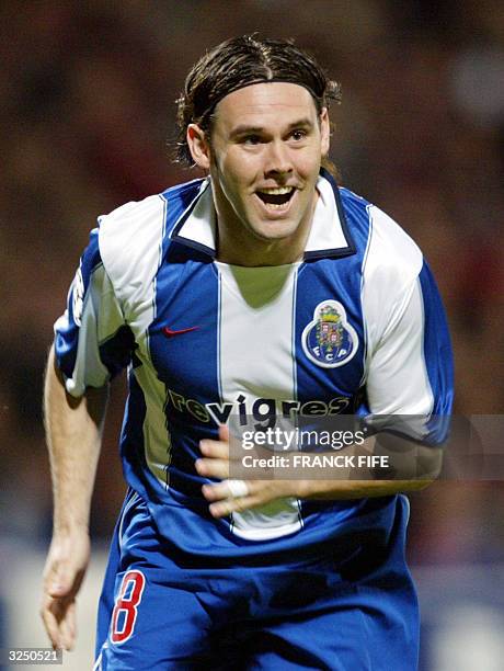Porto's Portuguese midfielder Maniche jubilates after scoring the second goal during their Champions League quarter-final second leg football match...