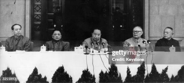 Chinese tea is in evidence as political leaders gather to mark the first anniversary of the death of Mao Tse-Tung. President Hua Kuo Feng is with...