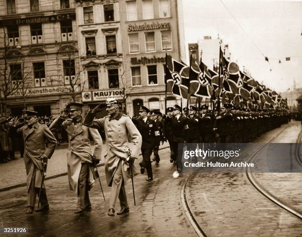 Nazi German forces reoccupy the Rhineland entering Cologne.