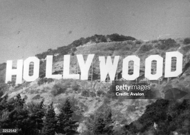 The large sign set in the hills on the outskirts of the film city of Hollywood in California.