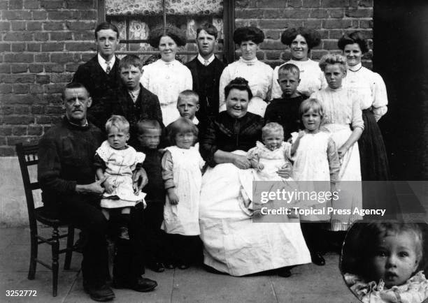 Mr and Mrs Terry of Greenwich, London, with part of their family of nineteen children.