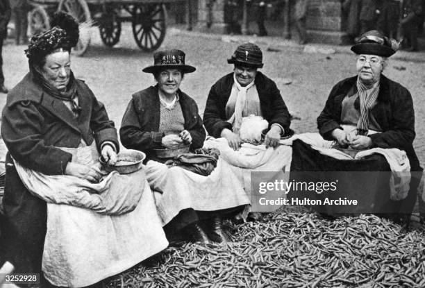 Mary, Queen of the Pea Shellers, enthroned on the left. 'For 56 years, she has amazed onlookers by the speed of her work. In Covent Garden Market a...