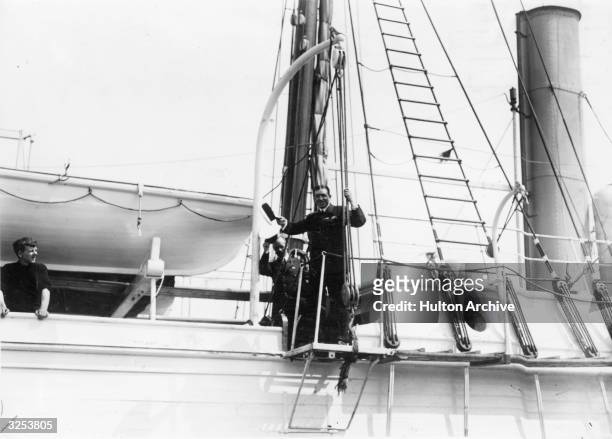 Irish explorer Sir Ernest Shackleton waves goodbye as his ship SS Endurance leaves Millwall Docks for the Antarctic.
