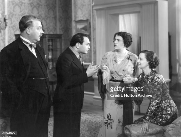 Edward G Robinson, Nigel Bruce, Constance Collier and Luli Deste in 'Thunder In The City,' a satire on British and American idiosyncrasies directed...