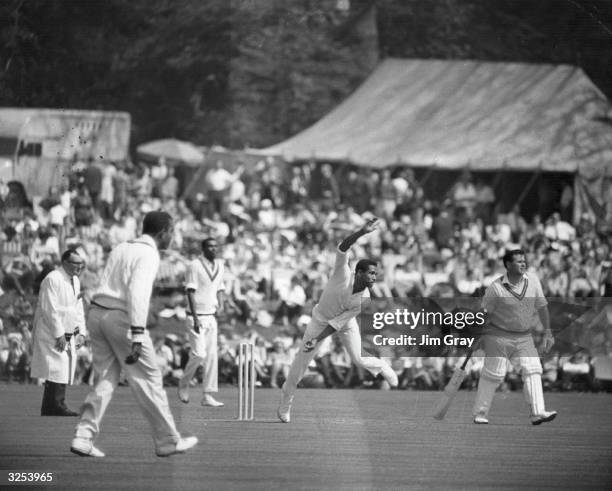 Captain of the West Indies cricket team, Gary Sobers bowling at a match in Arundel.