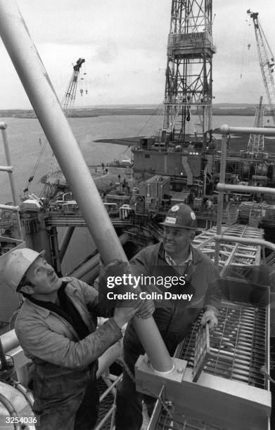 Workers on the 'Drill Master' oil rig at Stornaway.