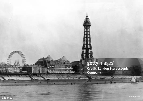 Blackpool Tower and sea front, Lancashire, the fairground ferris wheel visible on the left.