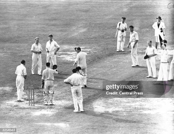 The England Captain leads the team in a special cheer for Don Bradman, the Australian Captain who is playing his last Test Match at the Oval. Sir...